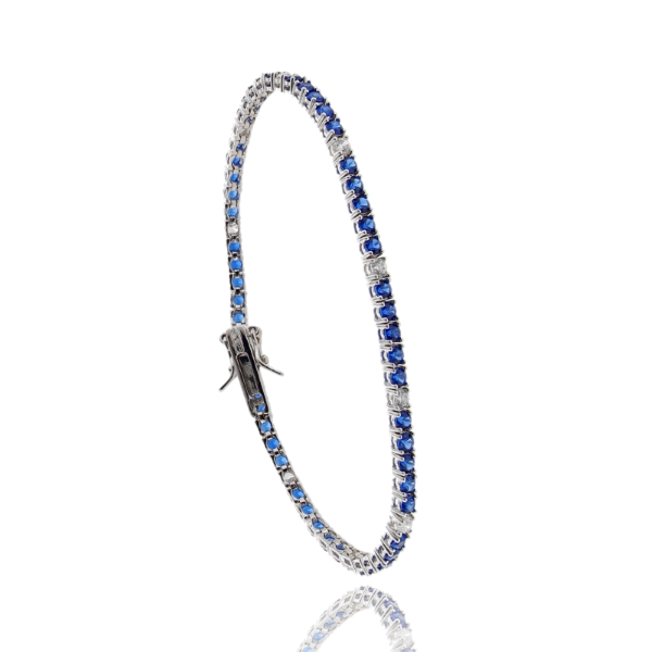 BRACCIALE TENNIS 4 GRIFFE CON ZIRCONI ALTERNATI 1-5 IN ARGENTO RODIATO TIT 925
