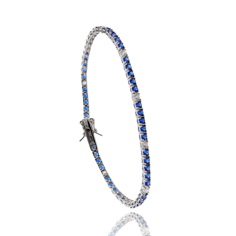 BRACCIALE TENNIS 4 GRIFFE CON ZIRCONI ALTERNATI 1-5 IN ARGENTO RODIATO TIT 925