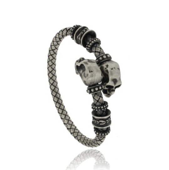 BRACCIALE RIGIDO CON TESCHI CONTRARIE IN ARGENTO BRUNITO TIT 925‰